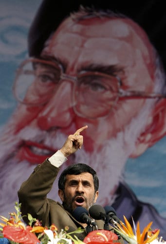 Iranian President Mahmoud Ahmadinejad, addresses a crowd during a rally to celebrate the 29th anniversary of the 1979 Islamic Revolution at Azadi Square in Tehran on Monday in Tehran, Iran, Monday, Feb. 11, 2008. Iran's supreme leader Ayatollah Ali Khamenei's picture is seen on background.(AP Photo/Hasan Sarbakhshian) 
