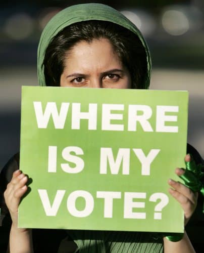 Mahsa, who provided only her first name, holds a sign protesting the recent election in Iran during a protest at the American Muslim Association in Oklahoma City, Thursday, June 18, 2009. (AP Photo/The Oklahoman, Steve Gooch) 