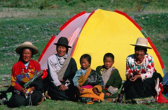 Family from Xiahe community in front of their tent.