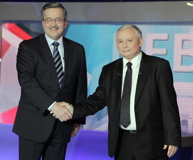 Bronislaw Komorowski, left, speaker of the Parliament and presidential candidate from the Civic Platform party, and Jaroslaw Kaczynski, presidential candidate of the Law and Justice party, shake hands prior to their second face-to-face televised debate at TVP studio in Warsaw, Poland, Wednesday, June 30, 2010, ahead of the presidential election run-off on July 4. (AP Photo/Czarek Sokolowski)