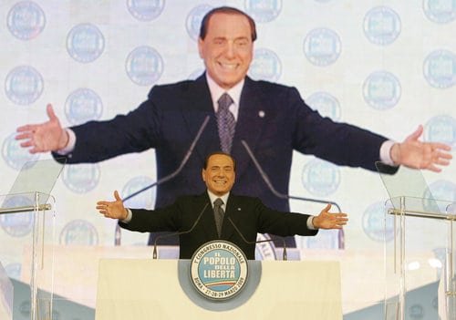 Italian Premier Silvio Berlusconi delivers his speech on the occasion of the founding congress of a new center-right party called Popolo della Liberta' (People of Freedom), uniting Berlusconi's Forza Italia with the National Alliance party, in Rome, Friday, March 27, 2009. (AP Photo/Pier Paolo Cito) 