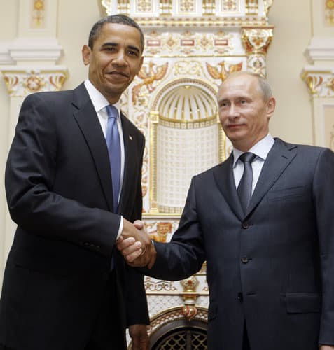 President Barack Obama, left, shakes hands with Russian Prime Minister Vladimir Putin during a meeting at Novo Ogaryovo, Tuesday, July 7, 2009, in Moscow. (AP Photo/Haraz N. Ghanbari)
