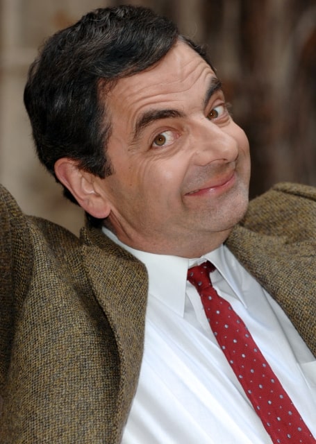 British comedian and actor Rowan Atkinson poses for pictures with a scale Eiffel tower, as he promotes his new film Mr. Bean's Holiday throughout Europe, during a photocall held at the Plaza Athenee hotel in Paris, France, on April 11, 2007. Photo by Nicolas Khayat/ABACAPRESS.COM