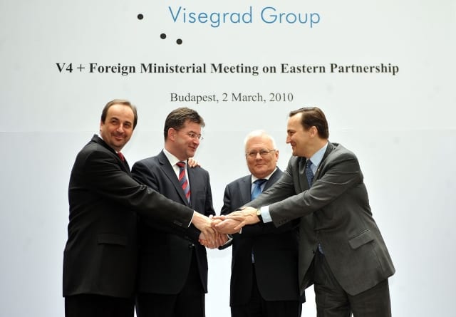 Foreign Ministers of the Visegrad Group states, left to right, Jan Kohout of Czechia, Miroslav Lajcak of Slovakia, Peter Balazs of Hungary and Radoslaw Sikorski of Poland, hold their hands as they pose for a photo at the start of their meeting in Budapest, Tuesday, March 2, 2010. The aim of their discussion is to advance the European Union Eastern Partnership Porgram. The meeting is also attended by representatives of the Baltic states as well as those of Ukraine, Belarus, Moldavia, Georgia, Azerbaijan and Armenia. (AP Photo/MTI, Tamas Kovacs)