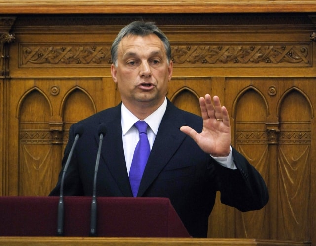 Hungarian Prime Minister Viktor Orban announces his government's new economic rescue package programme during the plenary session of the lawmakers in the parliament building in Budapest, Hungary, Tuesday, June 8, 2010. (AP Photos/MTI, Zsolt Szigetvary) =@=