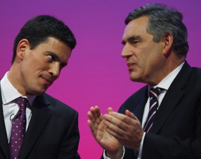Britain's Prime Minister and leader of the ruling Labour Party Gordon Brown, right, applauds Britain's Foreign Secretary David Miliband, left, after Miliband delivered a speech at the final day of the annual party conference in the southern coastal town of Brighton, England, Thursday Oct. 1, 2009. Labour party which has been in power since 1997, is trailing in the opinion polls behind the opposition right of centre Conservative party, with a general election due in the spring of 2010. (AP Photo/Lefteris Pitarakis) 