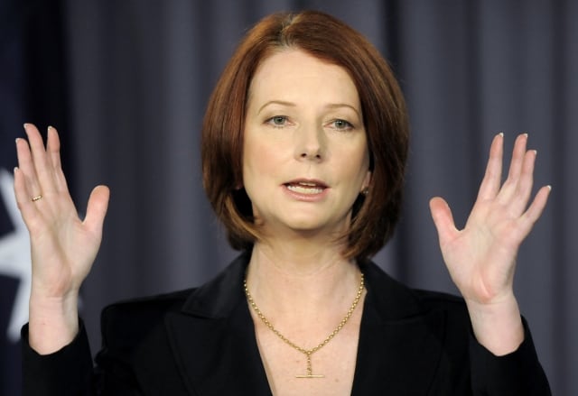 Australia's Prime Minister Julia Gillard speaks at the national press club in Canberra, Australia, Thursday, July 15, 2010. Australia's government bolstered its economic credentials ahead of looming elections by releasing new treasury data Wednesday that showed its reversal on a promised mining tax had not diminished its budget forecasts. The latest figures are even better than the treasury's last budget outlook, released in May, which showed Australia's finances would be back in surplus in the 2012-13 fiscal year despite billions of dollars in government stimulus spending to avoid recession. The improvement, largely due to soaring prices for Australian energy and mineral exports, is expected to come despite Prime Minister Julia Gillard abandoning plans to introduce a 40 percent tax on mining companies' burgeoning profits.(AP Photo/Mark Graham)