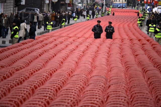 A view of chairs lined up along the main street in Sarajevo, Bosnia and Herzegovina, on April 6, 2012, to mark the 20th anniversary of the bloodiest conflict in Europe since World War II. More than 11,000 red chairs, symbolizing 11541 victims of the conflict, lined Sarajevo's main avenue today as Bosnians marked the anniversary of the bloody conflict with songs and remembrance. Thousands of people gathered as a choir accompanied by a small classical orchestra performed an arrangement of 14 songs, most of them composed during the city's bloody siege. Photo by Samir Yordamovic/AA/ABACAPRESS.COM # 315943_003
