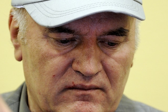 Former Bosnian Serb Gen. Ratko Mladic sits in the court room during his initial appearance at the U.N.'s Yugoslav war crimes tribunal in The Hague, Netherlands, Friday, June 3, 2011. Mladic's appearance Friday at the Yugoslav war crimes tribunal in The Hague is his first public appearance since he went into hiding nearly 16 years ago, when he was indicted for genocide and war crimes committed in the 1992-95 Bosnian war. (AP Photo/Martin Meissner, Pool)